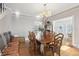 Formal dining room showcasing a large wooden table, ornate chandelier, and hardwood floors at 757 32Nd N Ave, St Petersburg, FL 33704