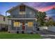 Charming two-story home with a front porch and second story balcony, plus a red front door at 757 32Nd N Ave, St Petersburg, FL 33704