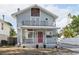 Charming two-story home with a front porch and second story balcony, plus a red front door at 757 32Nd N Ave, St Petersburg, FL 33704