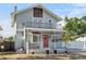 Charming two-story home with a front porch and second story balcony, plus a red front door at 757 32Nd N Ave, St Petersburg, FL 33704