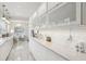 Contemporary kitchen boasts white cabinetry, marble backsplash, and a spacious countertop area at 757 32Nd N Ave, St Petersburg, FL 33704