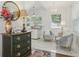 Bright living area featuring white marble floors and a chandelier, plus an antique dresser at 757 32Nd N Ave, St Petersburg, FL 33704
