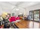 Bright living room with wood floors, tin ceiling, and large windows, creating a perfect spot for relaxation and entertainment at 757 32Nd N Ave, St Petersburg, FL 33704