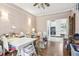 Spacious office with hardwood floors, adjacent kitchen with white cabinets and appliances, and plenty of room to work at 757 32Nd N Ave, St Petersburg, FL 33704