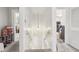 Bright stairway with white walls, pendant lighting, and open doorways, offering a glimpse into other rooms at 757 32Nd N Ave, St Petersburg, FL 33704