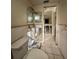 Bathroom with a toilet, mirror and tile flooring ready for renovations at 8326 Lafitte Dr, Hudson, FL 34667