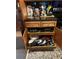 Functional kitchen cabinet with wooden drawers and shelves, revealing organized cookware and utensils at 836 Magellan Dr, Sarasota, FL 34243