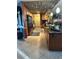 Modern kitchen with stainless steel appliances, ample counter space, and stylish lighting fixtures at 836 Magellan Dr, Sarasota, FL 34243