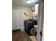 Functional laundry room with modern washer/dryer, sink, and a neutral color scheme at 836 Magellan Dr, Sarasota, FL 34243