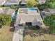 Aerial view of a home with a fenced-in backyard and in-ground swimming pool at 9218 Glen Moor Ln, Port Richey, FL 34668