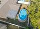 Aerial view of a private backyard with an above ground pool, perfect for outdoor fun and relaxation at 9218 Glen Moor Ln, Port Richey, FL 34668