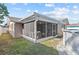 Charming backyard with screened patio and above-ground pool, ideal for relaxation and outdoor gatherings at 9218 Glen Moor Ln, Port Richey, FL 34668