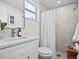 Updated bathroom showcases a walk-in shower, white vanity and neutral color scheme at 9218 Glen Moor Ln, Port Richey, FL 34668