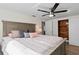 Bedroom with a ceiling fan, wood-look flooring and closet at 9218 Glen Moor Ln, Port Richey, FL 34668
