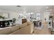 Open-concept living space with modern furnishings and a dining area adjacent to the kitchen at 9218 Glen Moor Ln, Port Richey, FL 34668