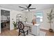 Bright office with two windows, hardwood floors, and a ceiling fan at 9218 Glen Moor Ln, Port Richey, FL 34668