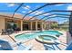 Beautiful screened pool and spa with brick patio, outdoor seating, and landscaping for relaxation and entertainment at 1013 Stella Vara Dr, Lutz, FL 33548