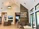 Elegant clubhouse with a stone accent wall, open entryway, and bright natural light at 10982 Banyan Breeze Blvd, Land O Lakes, FL 34638