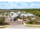Beautiful community center with covered entrance, lush landscaping, and convenient parking at 10982 Banyan Breeze Blvd, Land O Lakes, FL 34638