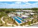 Aerial photo of the pool, lawn bowling, and bocce ball courts, near community center at 10982 Banyan Breeze Blvd, Land O Lakes, FL 34638