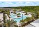 Gorgeous resort-style pool with lounge chairs and palm trees, perfect for relaxation and recreation at 10982 Banyan Breeze Blvd, Land O Lakes, FL 34638