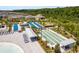 Aerial image showing a community shuffleboard and bocce ball court at 10982 Banyan Breeze Blvd, Land O Lakes, FL 34638