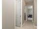 Hallway with doors leading to other rooms at 10982 Banyan Breeze Blvd, Land O Lakes, FL 34638