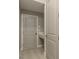 Hallway with doors, lighting, and neutral paint at 10982 Banyan Breeze Blvd, Land O Lakes, FL 34638