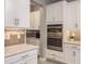 Well-appointed kitchen featuring modern appliances, custom cabinets, and a seamless flow into adjacent spaces at 10982 Banyan Breeze Blvd, Land O Lakes, FL 34638