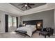 Beautiful main bedroom with tray ceilings, recessed lighting, and a modern color scheme at 10982 Banyan Breeze Blvd, Land O Lakes, FL 34638