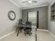 Office space with modern wood accent wall, a ceiling fan, and natural light at 10982 Banyan Breeze Blvd, Land O Lakes, FL 34638