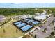 Overhead shot of the blue outdoor pickleball courts with black fencing available at the community recreation center at 10982 Banyan Breeze Blvd, Land O Lakes, FL 34638