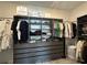 Spacious walk-in closet featuring custom shelving, drawers, and ample storage space for clothing and accessories at 10982 Banyan Breeze Blvd, Land O Lakes, FL 34638