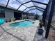 Inviting screened-in pool with a spacious paver patio and seating at 11219 Paddock Manor Ave, Riverview, FL 33569
