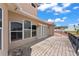 Balcony featuring brick flooring and iron railing with a view of the property and neighborhood at 11715 Taylor Rd, Thonotosassa, FL 33592