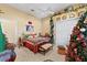 Cozy bedroom decorated with holiday-themed decor and featuring a comfortable bed and ample closet space at 11715 Taylor Rd, Thonotosassa, FL 33592