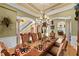 Elegant dining room with decorative chandelier, staircase and ornate table setting at 11715 Taylor Rd, Thonotosassa, FL 33592