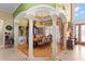 Formal dining room with elegant columns, hardwood floors, and decorative lighting at 11715 Taylor Rd, Thonotosassa, FL 33592