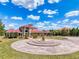 Beautiful home with circular driveway, mature landscaping, and red tile roof at 11715 Taylor Rd, Thonotosassa, FL 33592