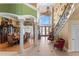 Spacious foyer with high ceilings, tile floors, and staircase leading to the second floor at 11715 Taylor Rd, Thonotosassa, FL 33592