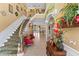 Grand foyer with staircase, soaring ceilings, elegant decor, and tile flooring at 11715 Taylor Rd, Thonotosassa, FL 33592