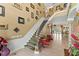 Elegant foyer with grand staircase, high ceilings, and stylish accents at 11715 Taylor Rd, Thonotosassa, FL 33592