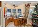Open-concept kitchen features granite counters, bar seating, and bay windows with lake views at 11715 Taylor Rd, Thonotosassa, FL 33592