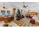 Spacious living room with high ceilings, ceiling fans, and open-concept design to the kitchen at 11715 Taylor Rd, Thonotosassa, FL 33592