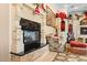 Cozy living room showcasing a beautiful brick fireplace, mantle and classic furniture at 11715 Taylor Rd, Thonotosassa, FL 33592