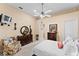 Cozy main bedroom featuring a plush bed, floral chair, and a dresser set with decor at 11715 Taylor Rd, Thonotosassa, FL 33592