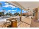 Covered patio with outdoor kitchen, providing a view of the pool and lake at 11715 Taylor Rd, Thonotosassa, FL 33592