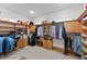 Spacious walk-in closet with custom shelving, hanging rods, and ample storage for clothes and accessories at 11715 Taylor Rd, Thonotosassa, FL 33592