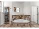 Bathroom with tub, shower and decorative tile accents at 11910 Keating Dr, Tampa, FL 33626