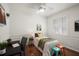 Comfortable bedroom with natural light, hardwood floors, neutral color palette, and stylish accents at 11910 Keating Dr, Tampa, FL 33626